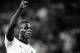 MILAN, ITALY - AUGUST 28: (EDITORS NOTE: Image has been converted to black and white.) Mario Balotelli of AC Milan celebrates victory at the end the UEFA Champions League Play-off Second Leg match between AC Milan v PSV Eindhoven at Stadio Giuseppe Meazza on August 28, 2013 in Milan, Italy. (Photo by Claudio Villa/Getty Images)