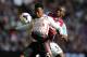 BIRMINGHAM, ENGLAND - AUGUST 24: Liverpool player Daniel Sturridge (l) holds off Villa player Jores Okore during the Barclays Premier League match between Aston Villa and Liverpool at Villa Park on August 24, 2013 in Birmingham, England. (Photo by Stu Forster/Getty Images)