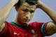 FARO, PORTUGAL - AUGUST 14: Cristiano Ronaldo of Portugal brushes his hair with water prior to start the International Friendly match between Portugal and Netherlands at Estadio Algarve on August 14, 2013 in Faro, Portugal. (Photo by Gonzalo Arroyo Moreno/Getty Images)