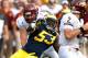 ANN ARBOR, MI - AUGUST 31: Mario Ojemudia #53 of the Michigan Wolverines tries to get around the block of Jake Olson #73 of the Central Michigan Chippewas at Michigan Stadium on August 31, 2013 in Ann Arbor, Michigan. Michigan won the 59-9. (Photo by Gregory Shamus/Getty Images)