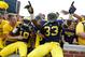 ANN ARBOR, MI - AUGUST 31: Taco Charlton #33 of the Michigan Wolverines and Blake Countess #18 celebrates a 59-9 win over the Central Michigan Chippewas at Michigan Stadium on August 31, 2013 in Ann Arbor, Michigan. (Photo by Gregory Shamus/Getty Images)
