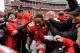 COLUMBUS, OH - NOVEMBER 24: Kenny Guiton #13 of the Ohio State Buckeyes is mobbed by fans on the field after Ohio State defeated the Michigan Wolverines 26-21at Ohio Stadium on November 24, 2012 in Columbus, Ohio. (Photo by Jamie Sabau/Getty Images)