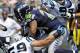 Sep 8, 2013; Charlotte, NC, USA; Seattle Seahawks running back Marshawn Lynch (24) runs for a first down during the game against the Carolina Panthers at Bank of America Stadium. Mandatory Credit: Sam Sharpe-USA TODAY Sports