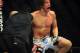 Jul 21, 2012; Calgary, AB, CANADA; Matt Riddle (blue gloves) celebrates defeating Chris Clements welterweight bout of UFC 149 at the Scotiabank Saddledome. Mandatory Credit: Anne-Marie Sorvin-USA TODAY Sports