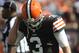 Sep 8, 2013; Cleveland, OH, USA; Cleveland Browns quarterback Brandon Weeden (3) walks off the field after being sacked during the fourth quarter against the Miami Dolphins at FirstEnergy Stadium. Mandatory Credit: Ken Blaze-USA TODAY Sports