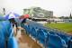 LEEDS, ENGLAND - SEPTEMBER 06: Fans wait patiently for the rain to stop ahead of the 1st Nat West One Day International between England and Austrailia at Headingley Carnegie Stadium on September 6, 2013 in Leeds, England. (Photo by Laurence Griffiths/Getty Images)