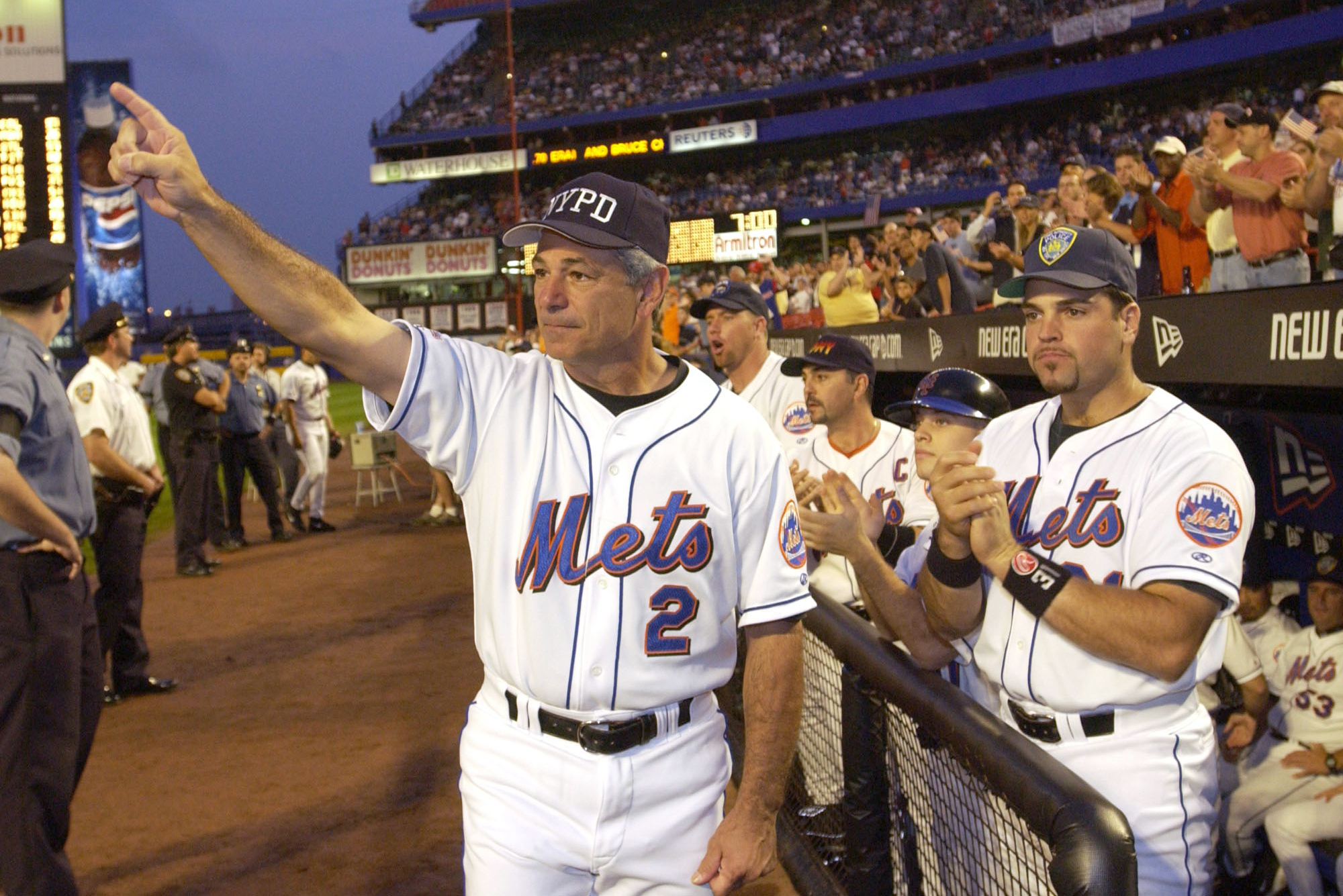 Former New York Mets manager Bobby Valentine waves as he is