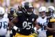 Sep 8, 2013; Pittsburgh, PA, USA; Pittsburgh Steelers linebacker Jarvis Jones (95) celebrates a tackle against the Tennessee Titans during the first half at Heinz Field. Mandatory Credit: Jason Bridge-USA TODAY Sports