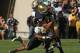 SOUTH BEND, IN - SEPTEMBER 08: Troy Niklas #85 of the Notre Dame Fighting Irish is tackled by Max Charlot #34 (L) and Frankie Williams #2 of the Purdue Boilermakers after a first down catch at Notre Dame Stadium on September 8, 2012 in South Bend, Indiana. Notre Dame defeated Purdue 21-17. (Photo by Jonathan Daniel/Getty Images)