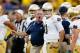 ANN ARBOR, MI - SEPTEMBER 07: Head coach Brian Kelly of the Notre Dame Fighting Irish
talks to quarterback Tommy Rees #11 before the game against the Michigan Wolverines at Michigan Stadium on September 7, 2013 in Ann Arbor, Michigan. (Photo by Gregory Shamus/Getty Images)
