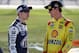 JOLIET, IL - SEPTEMBER 13: Joey Logano, driver of the #22 Shell-Pennzoil Ford, talks to Brad Keselowski, driver of the #2 Miller Lite Ford, on the grid during qualifying for the NASCAR Sprint Cup Series Geico 400 at Chicagoland Speedway on September 13, 2013 in Joliet, Illinois. (Photo by Geoff Burke/Getty Images)