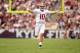 Sep 14, 2013; College Station, TX, USA; Alabama Crimson Tide quarterback A.J. McCarron (10) celebrates throwing a touchdown against the Texas A&M Aggies during the first half at Kyle Field. Mandatory Credit: Thomas Campbell-USA TODAY Sports