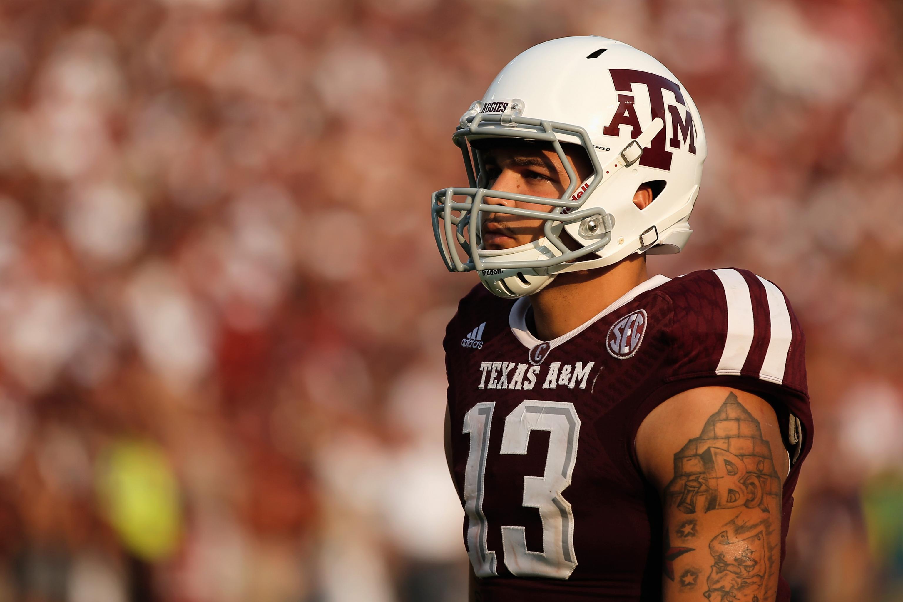 Mike Evans Texas A&M Aggies Unsigned White Jersey Running and Breaking  Tackle with Ball vs. Oklahoma Sooners Photograph