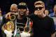 Sep 14, 2013; Las Vegas, NV, USA; Floyd Mayweather Jr (left) and Justin Bieber appear in the ring after Mayweather defeated Canelo Alvarez by a majority decision at their WBC and WBA super welterweight titles fight at MGM Grand Garden Arena. Mandatory Credit: Jayne Kamin-Oncea-USA TODAY Sports