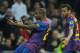 MADRID, SPAIN - JANUARY 18: Eric Abidal (L) of FC Barcelona celebrates with his teammate Daniel Alves after scoring his sides second goal during the Copa del Rey quarter final match between Real Madrid and Barcelona at Estadio Santiago Bernabeu on January 18, 2012 in Madrid, Spain. (Photo by Jasper Juinen/Getty Images)