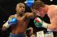 Sep 14, 2013; Las Vegas, NV, USA; Floyd Mayweather Jr. (blue gloves) and Canelo Alvarez battle it during their during their WBC and WBA super welterweight titles fight at MGM Grand Garden Arena. Mandatory Credit: Jayne Kamin-Oncea-USA TODAY Sports