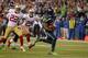 SEATTLE, WA - SEPTEMBER 15: Running back Marshawn Lynch #24 of the Seattle Seahawks rushes for a touchdown in the third quarter against the San Francisco 49ers at CenturyLink Field on September 15, 2013 in Seattle, Washington. (Photo by Otto Greule Jr/Getty Images)