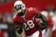 GLENDALE, AZ - SEPTEMBER 15: Running back Rashard Mendenhall #28 of the Arizona Cardinals carries the ball prior to the start of the game against the Detroit Lions at University of Phoenix Stadium on September 15, 2013 in Glendale, Arizona. (Photo by Jeff Gross/Getty Images)