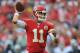 KANSAS CITY, MO - SEPTEMBER 15: Quarterback Alex Smith of the Kansas City Chiefs throws a pass down field against the Dallas Cowboys during the first half on September 15, 2013 at Arrowhead Stadium in Kansas City, Missouri. (Photo by Peter Aiken/Getty Images)