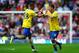 SUNDERLAND, ENGLAND - SEPTEMBER 14: Aaron Ramsey (R) of Arsenal celebrates his goal with team mate Kieran Gibbs during the Barclays Premier League match between Sunderland and Arsenal at the Stadium of Light on September 14, 2013 in Sunderland, England. (Photo by Laurence Griffiths/Getty Images)