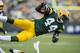 GREEN BAY, WI - SEPTEMBER 15: James Starks #44 of the Green Bay Packers sails through the air on a tackle by the Washington Redskins at Lambeau Field on September 15, 2013 in Green Bay, Wisconsin. The Packers defeated the Redskins 38-20. (Photo by Wesley Hitt/Getty Images)