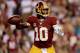 LANDOVER, MD - SEPTEMBER 09: Quarterback Robert Griffin III #10 of the Washington Redskins looks to pass in the first quarter agianst the Philadelphia Eagles at FedExField on September 9, 2013 in Landover, Maryland. (Photo by Patrick Smith/Getty Images)