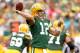 GREEN BAY, WI - SEPTEMBER 15: Aaron Rodgers #12 of the Green Bay Packers throws against the the Washington Redskins at Lambeau Field on September 15, 2013 in Green Bay, Wisconsin. (Photo by Matthew Stockman/Getty Images)