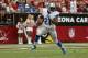 GLENDALE, AZ - SEPTEMBER 15: Running back Reggie Bush #21 of the Detroit Lions carries the ball against the Arizona Cardinals at University of Phoenix Stadium on September 15, 2013 in Glendale, Arizona. (Photo by Jeff Gross/Getty Images)