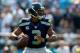 CHARLOTTE, NC - SEPTEMBER 08: Russell Wilson #3 of the Seattle Seahawks against the Carolina Panthers during their game at Bank of America Stadium on September 8, 2013 in Charlotte, North Carolina. (Photo by Streeter Lecka/Getty Images)