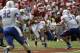NORMAN, OK - SEPTEMBER 14: Quarterback Blake Bell #10 of the Oklahoma Sooners looks for a hole in the Tulsa Hurricane defense September 14, 2013 at Gaylord Family-Oklahoma Memorial Stadium in Norman, Oklahoma. The Sooners defeated the Golden Hurricane 51-20. (Photo by Brett Deering/Getty Images)
