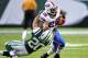 Sep 22, 2013; East Rutherford, NJ, USA; Buffalo Bills running back C.J. Spiller (28) pushes off New York Jets cornerback Kyle Wilson (20) at MetLife Stadium. Mandatory Credit: Robert Deutsch-USA TODAY Sports