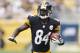 Sep 8, 2013; Pittsburgh, PA, USA; Pittsburgh Steelers wide receiver Antonio Brown (84) runs after a pass reception against the Tennessee Titans during the first quarter at Heinz Field. The Tennessee Titans won 16-9. Mandatory Credit: Charles LeClaire-USA TODAY Sports