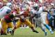 Sep 22, 2013; Landover, MD, USA; Detroit Lions running back Joique Bell (35) runs with the ball past Washington Redskins outside linebacker Brian Orakpo (98) and Redskins defensive end Jarvis Jenkins (99) in the third quarter at FedEx Field. The Lions won 27-20. Mandatory Credit: Geoff Burke-USA TODAY Sports