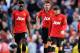 MANCHESTER, ENGLAND - SEPTEMBER 22: (L-R) Danny Welbeck, Michael Carrick, Wayne Rooney and Luis Antonio Valencia of Manchester United look dejected as Yaya Toure of Manchester City (not pictured) scores their second goal during the Barclays Premier League match between Manchester City and Manchester United at the Etihad Stadium on September 22, 2013 in Manchester, England. (Photo by Michael Regan/Getty Images)