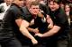 Security holds back Cody Rhodes (Photo by WWE.com)