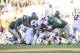 Sep 21, 2013; Waco, TX, USA; Louisiana Monroe Warhawks running back DeVontae McNeal (28) is tackled by Baylor Bears defensive lineman Terrell Brooks (88) during the second half at Floyd Casey Stadium. The Bears defeated the Warhawks 70-7. Mandatory Credit: Jerome Miron-USA TODAY Sports