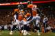 DENVER, CO - SEPTEMBER 23: Linebacker Wesley Woodyard #52 of the Denver Broncos celebrates with cornerback Dominique Rodgers-Cromartie #45 of the Denver Broncos after forcing a turnover on downs during the fourth quarter against the Oakland Raiders at Sports Authority Field Field at Mile High on September 23, 2013 in Denver, Colorado. The Broncos defeated the Raiders 37-21. (Photo by Justin Edmonds/Getty Images)