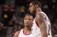 PORTLAND, OR - APRIL 17: Damian Lillard #0 of the Portland Trail Blazers shares a word with teammate LaMarcus Aldridge #12 during the game against the Golden State Warriors on April 17, 2013 at the Rose Garden Arena in Portland, Oregon. NOTE TO USER: User expressly acknowledges and agrees that, by downloading and or using this photograph, user is consenting to the terms and conditions of the Getty Images License Agreement. Mandatory Copyright Notice: Copyright 2013 NBAE (Photo by Cameron Browne/NBAE via Getty Images)