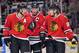 Feb 12, 2013; Chicago, IL, USA; Chicago Blackhawks defenseman Duncan Keith (left) and center Jonathan Toews (middle) and right wing Patrick Kane (right) talk during the overtime period against the Anaheim Ducks at the United Center. The Ducks beat the Blackhawks 3-2 in the shootout. Mandatory Credit: Rob Grabowski-USA TODAY Sports