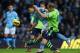 MANCHESTER, ENGLAND - NOVEMBER 17: Ron Vlaar of Aston Villa challenges Sergio Aguero of Manchester City during the Barclays Premier League match between Manchester City and Aston Villa at the Etihad Stadium on November 17, 2012 in Manchester, England. (Photo by Alex Livesey/Getty Images)