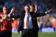 WEST BROMWICH, ENGLAND - MAY 19: Manchester United manager Sir Alex Ferguson is applauded by players after his 1,500th and final match in charge of the club following the Barclays Premier League match between West Bromwich Albion and Manchester United at The Hawthorns on May 19, 2013 in West Bromwich, England. (Photo by Richard Heathcote/Getty Images)