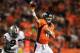 DENVER, CO - SEPTEMBER 23: Peyton Manning #18 of the Denver Broncos passes under pressure from Jason Hunter #93 of the Oakland Raiders at Sports Authority Field at Mile High on September 23, 2013 in Denver, Colorado. (Photo by Doug Pensinger/Getty Images)