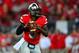 Sep 28, 2013; Columbus, OH, USA; Ohio State Buckeyes quarterback Braxton Miller (5) looks to pass during the fourth quarter against the Wisconsin Badgers at Ohio Stadium. Ohio State Buckeyes defeated Wisconsin Badgers 31-24. Mandatory Credit: Andrew Weber-USA TODAY Sports
