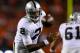 DENVER, CO - SEPTEMBER 23: Quarterback Terrelle Pryor #2 of the Oakland Raiders watches as the ball is snapped over his head during the third quarter against the Denver Broncos at Sports Authority Field Field at Mile High on September 23, 2013 in Denver, Colorado. The Broncos defeated the Raiders 37-21. (Photo by Justin Edmonds/Getty Images)