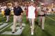 TEMPE, AZ - SEPTEMBER 28: Head coach Lane Kiffin (C) of the USC Trojans walks out to mid field following the college football game against the Arizona State Sun Devils at Sun Devil Stadium on September 28, 2013 in Tempe, Arizona. The Sun Devils defeated the Trojans 62-41. (Photo by Christian Petersen/Getty Images)
