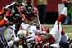 Sep 29, 2013; Atlanta, GA, USA; New England Patriots quarterback Tom Brady (12) recovers his own fumble on fourth down against the Atlanta Falcons during the second half at Georgia Dome. The Patriots defeated the Falcons 30-23. Mandatory Credit: Dale Zanine-USA TODAY Sports