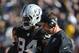 Sep 29, 2013; Oakland, CA, USA; Oakland Raiders head coach Dennis Allen (right) and outside linebacker Kevin Burnett (94) looks on against the Washington Redskins during the fourth quarter at O.co Coliseum. The Redskins defeated the Raiders 24-14. Mandatory Credit: Kyle Terada-USA TODAY Sports