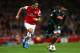 LONDON, ENGLAND - OCTOBER 01: Mesut Oezil of Arsenal goes past Camilo Zuniga of Napoli during UEFA Champions League Group F match between Arsenal FC and SSC Napoli at Emirates Stadium on October 1, 2013 in London, England. (Photo by Paul Gilham/Getty Images)