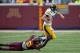 Sep 28, 2013; Minneapolis, MN, USA; Minnesota Golden Gophers linebacker James Manuel (9) tackles Iowa Hawkeyes quarterback Jake Rudock (15) in the second half at TCF Bank Stadium. The Hawkeyes won 23-7. Mandatory Credit: Jesse Johnson-USA TODAY Sports