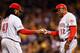 PITTSBURGH, PA - OCTOBER 01: Manager Dusty Baker #12 pulls Johnny Cueto #47 of the Cincinnati Reds in the fourth inning against the Pittsburgh Pirates during the National League Wild Card game at PNC Park on October 1, 2013 in Pittsburgh, Pennsylvania. (Photo by Jared Wickerham/Getty Images)